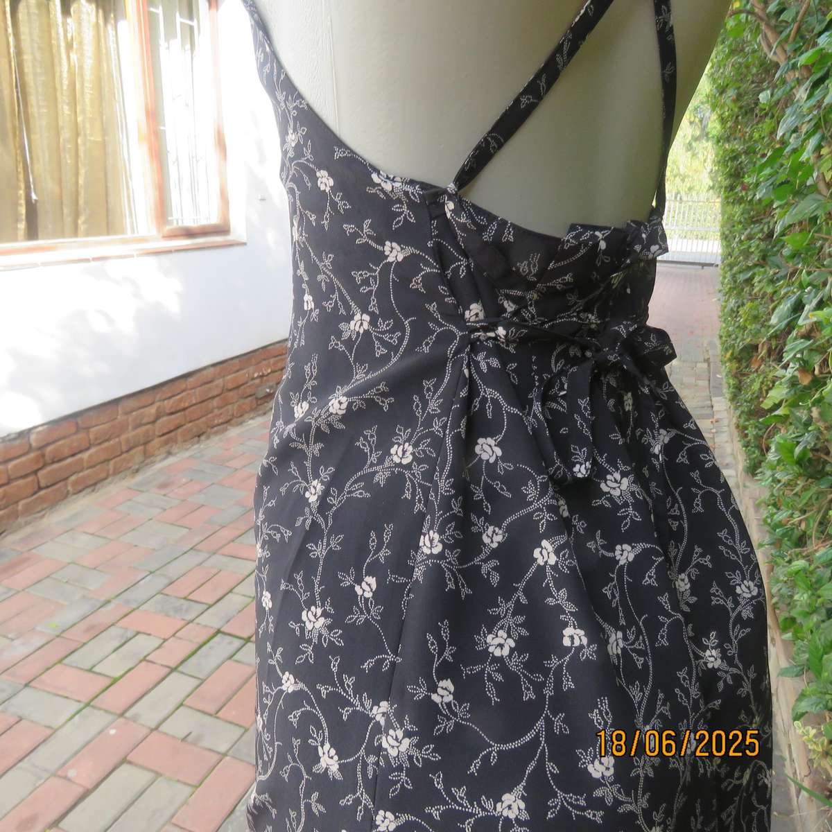 MADY black-white floral polyester low calf length dress. Bib front with straps. Size 34.