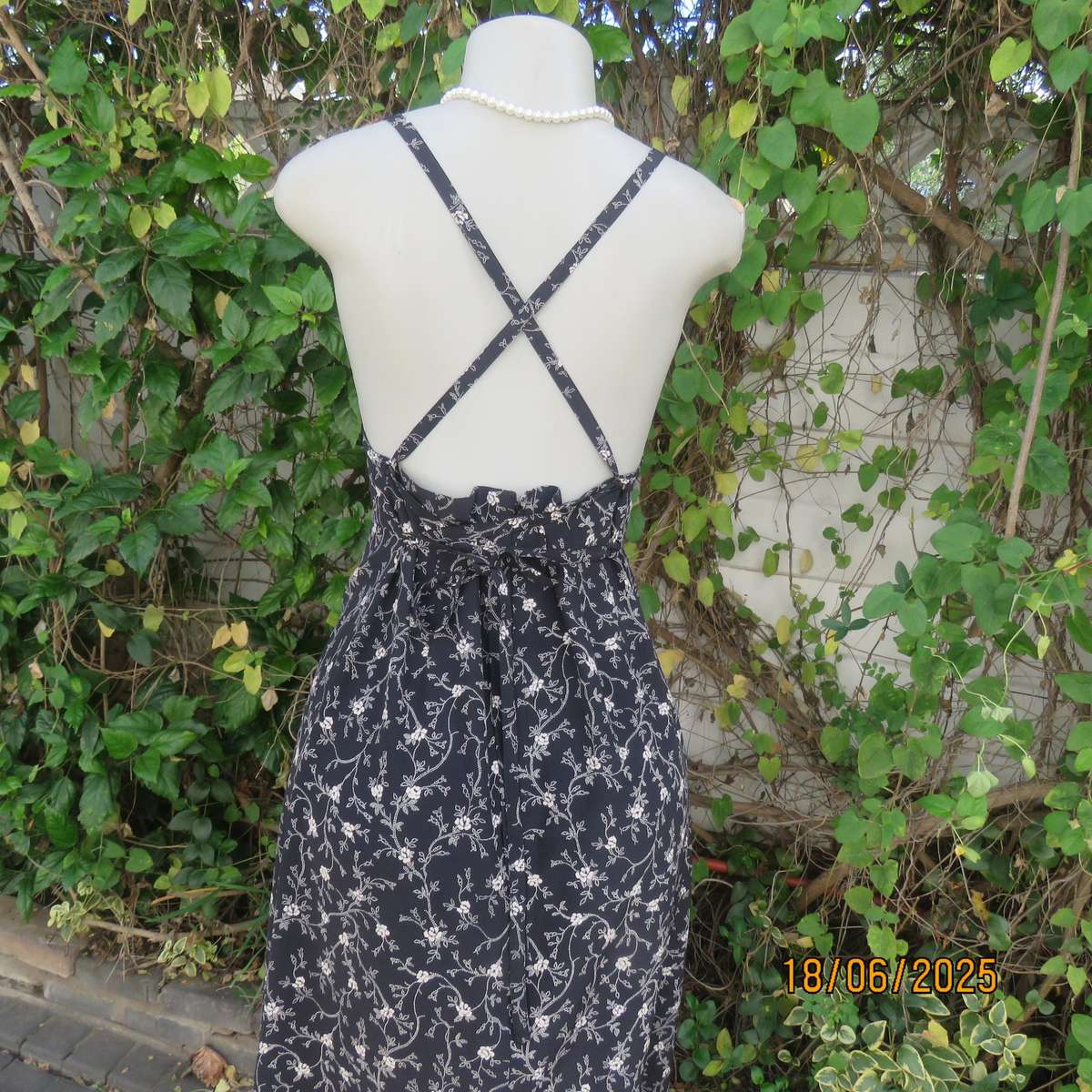 MADY black-white floral polyester low calf length dress. Bib front with straps. Size 34.