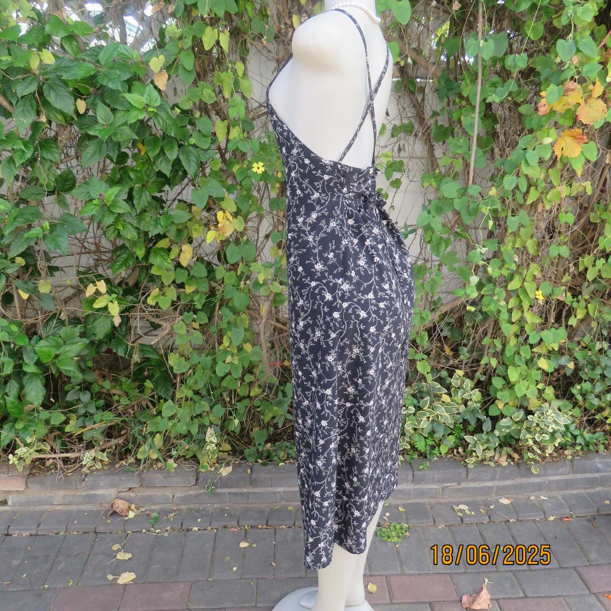 MADY black-white floral polyester low calf length dress. Bib front with straps. Size 34.