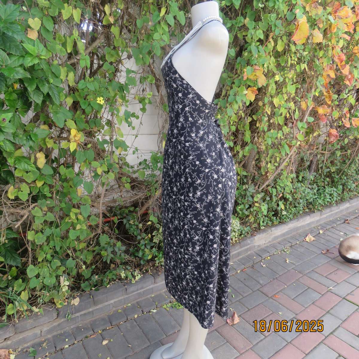 MADY black-white floral polyester low calf length dress. Bib front with straps. Size 34.