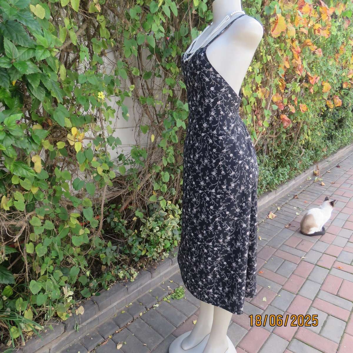 MADY black-white floral polyester low calf length dress. Bib front with straps. Size 34.