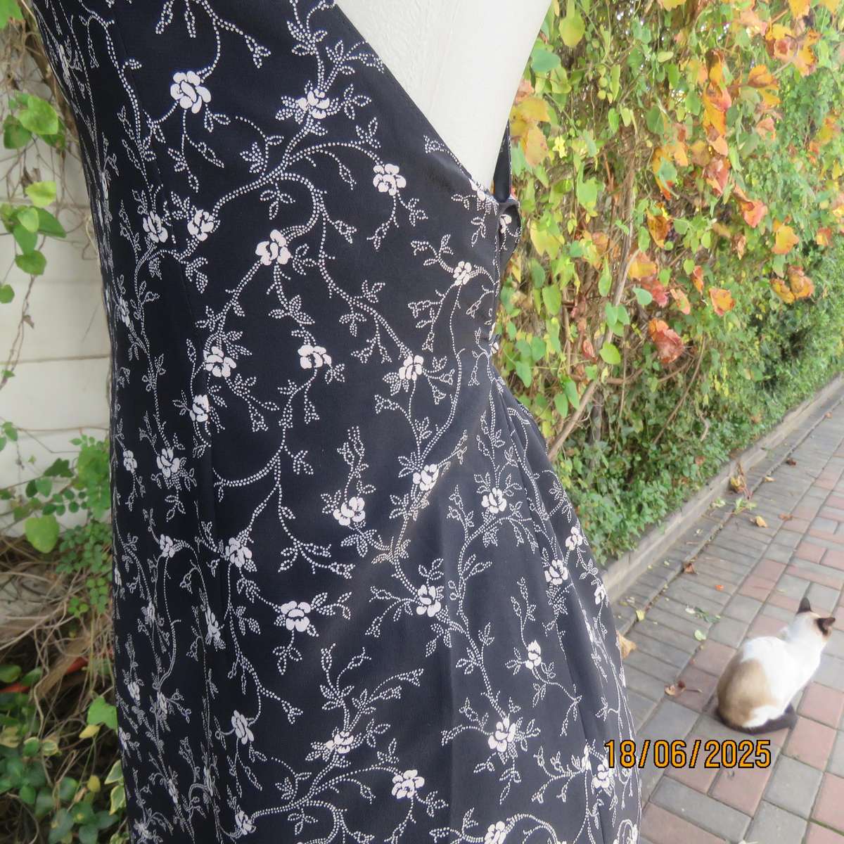 MADY black-white floral polyester low calf length dress. Bib front with straps. Size 34.