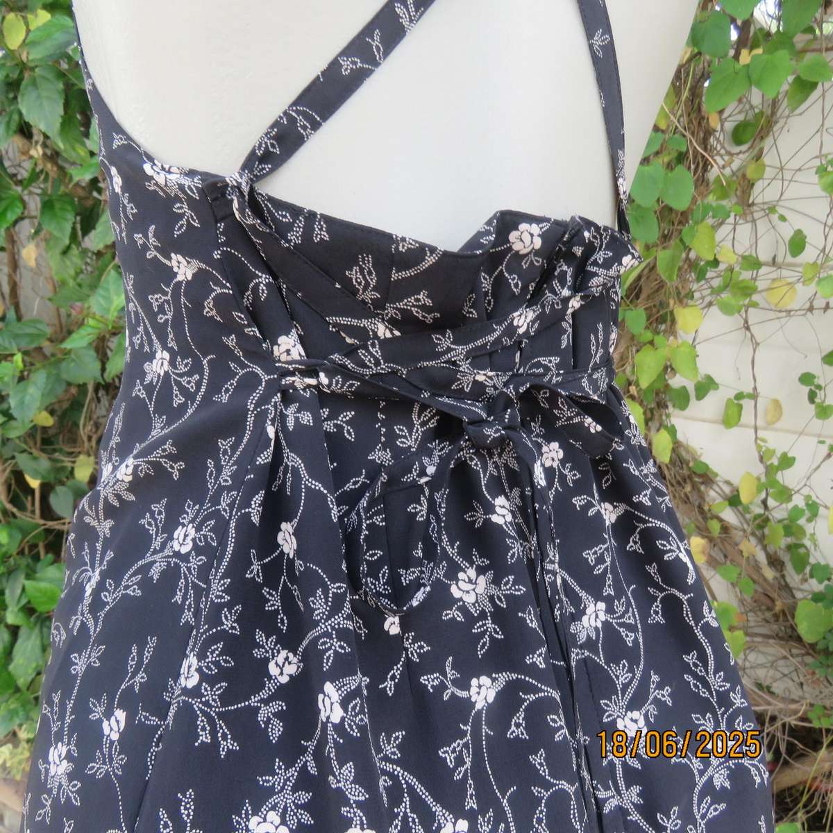 MADY black-white floral polyester low calf length dress. Bib front with straps. Size 34.