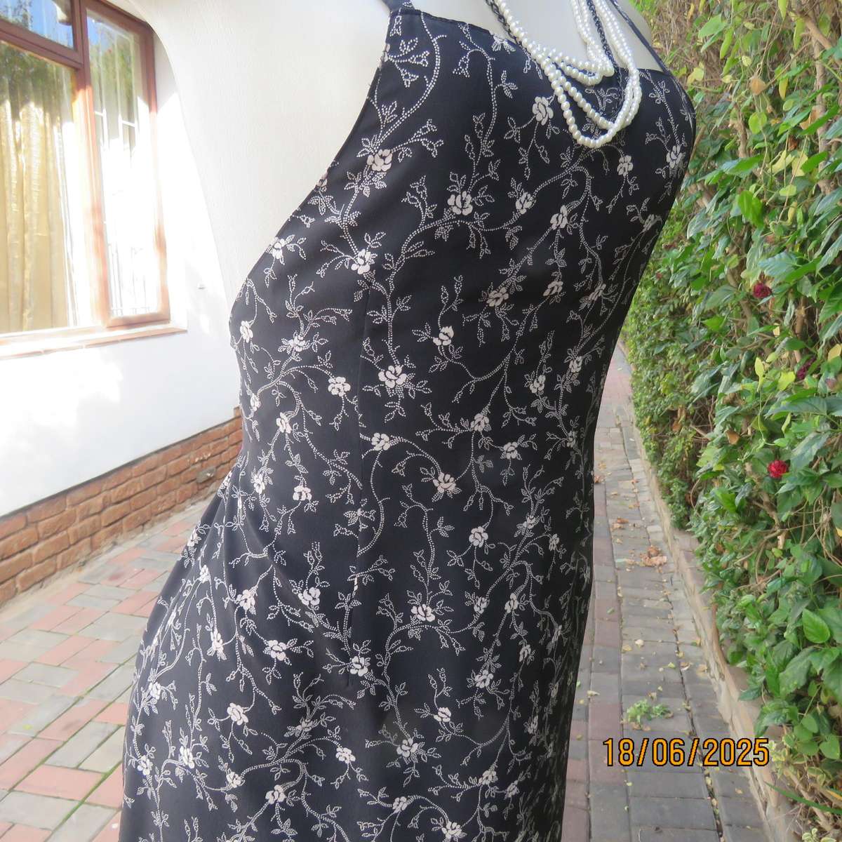 MADY black-white floral polyester low calf length dress. Bib front with straps. Size 34.