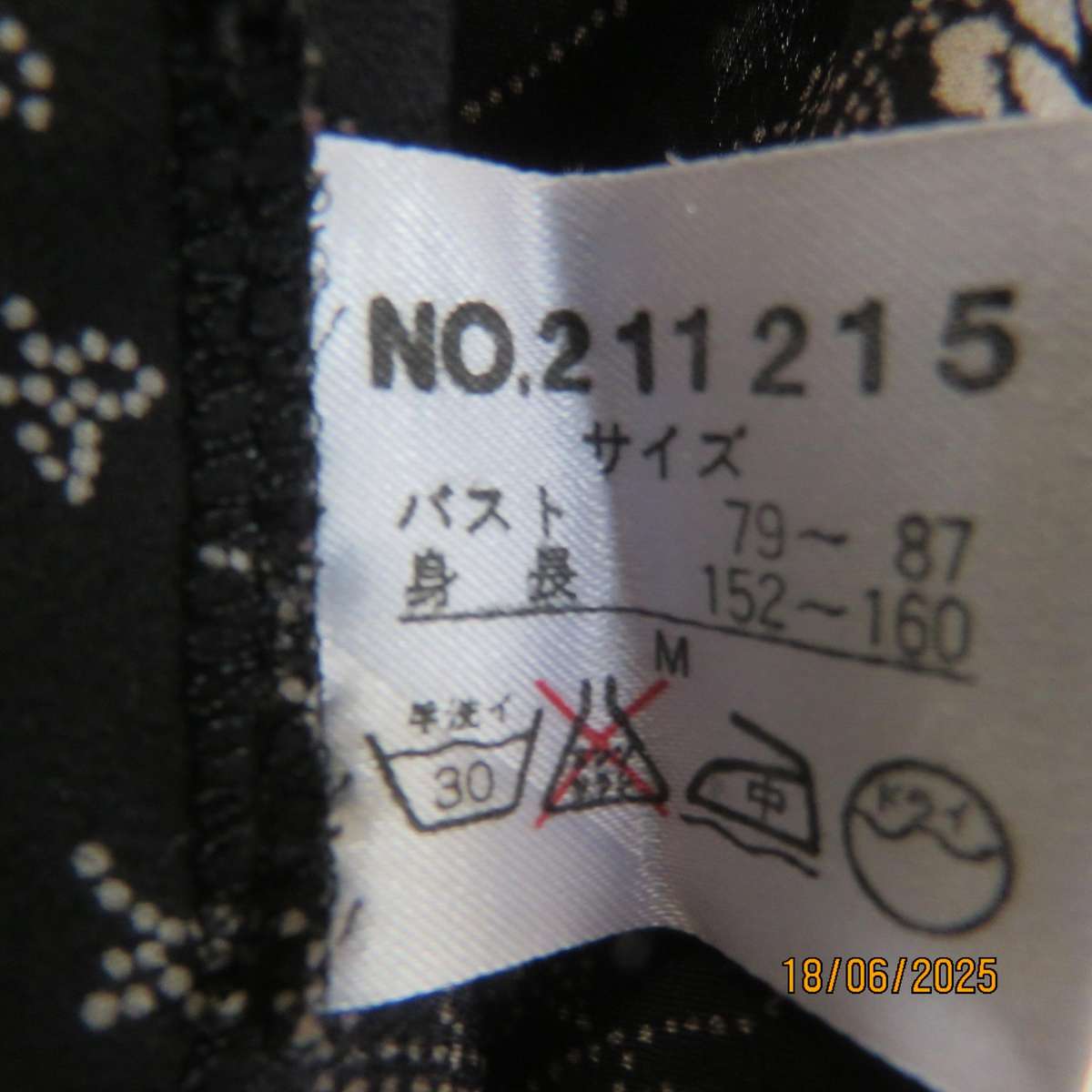 MADY black-white floral polyester low calf length dress. Bib front with straps. Size 34.