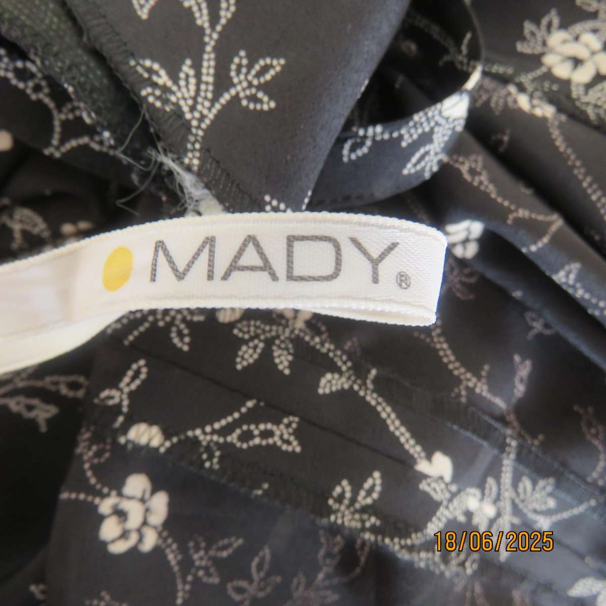MADY black-white floral polyester low calf length dress. Bib front with straps. Size 34.