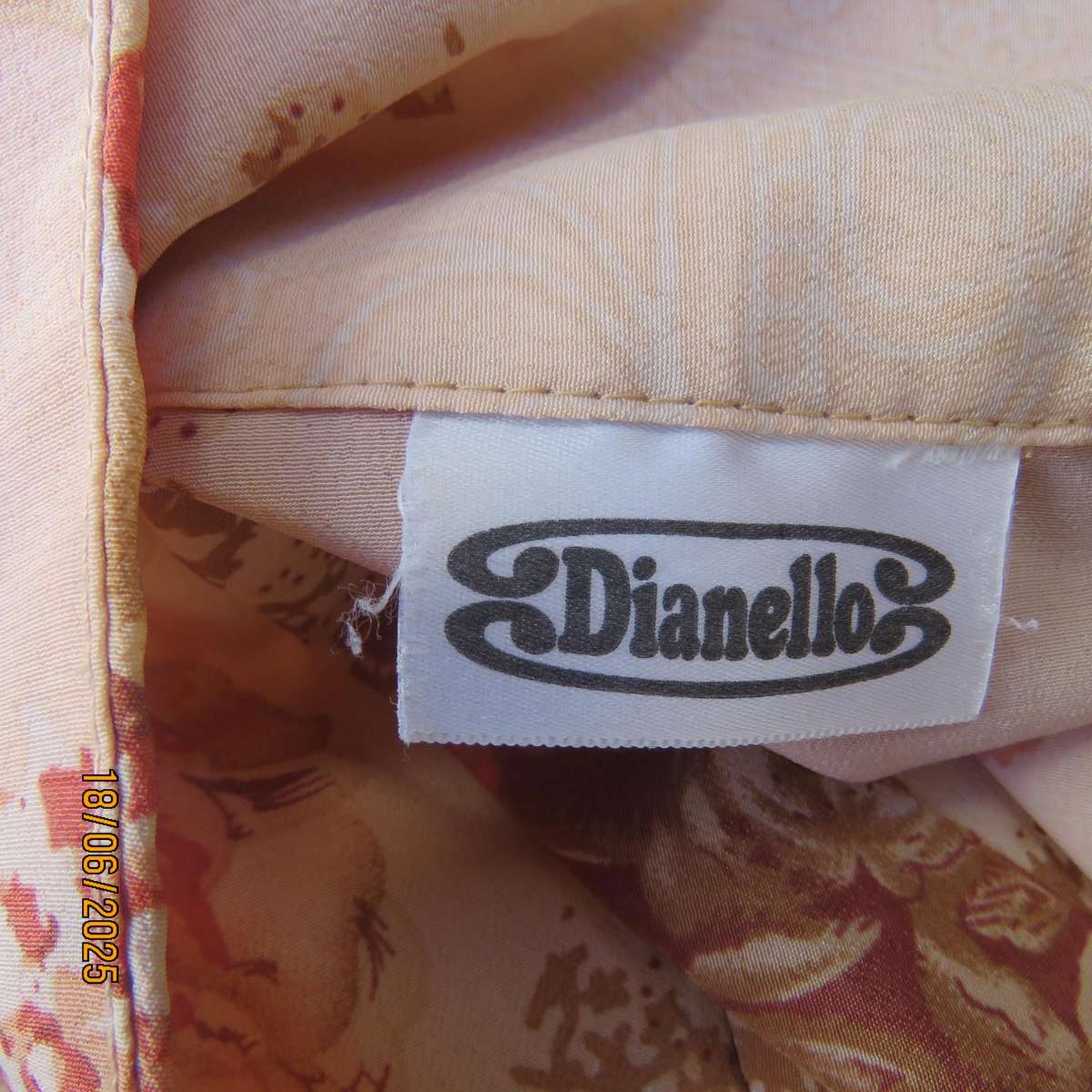DIANELLO soft peach polyester short sleeve top. Tan-crimson designs. Size 44