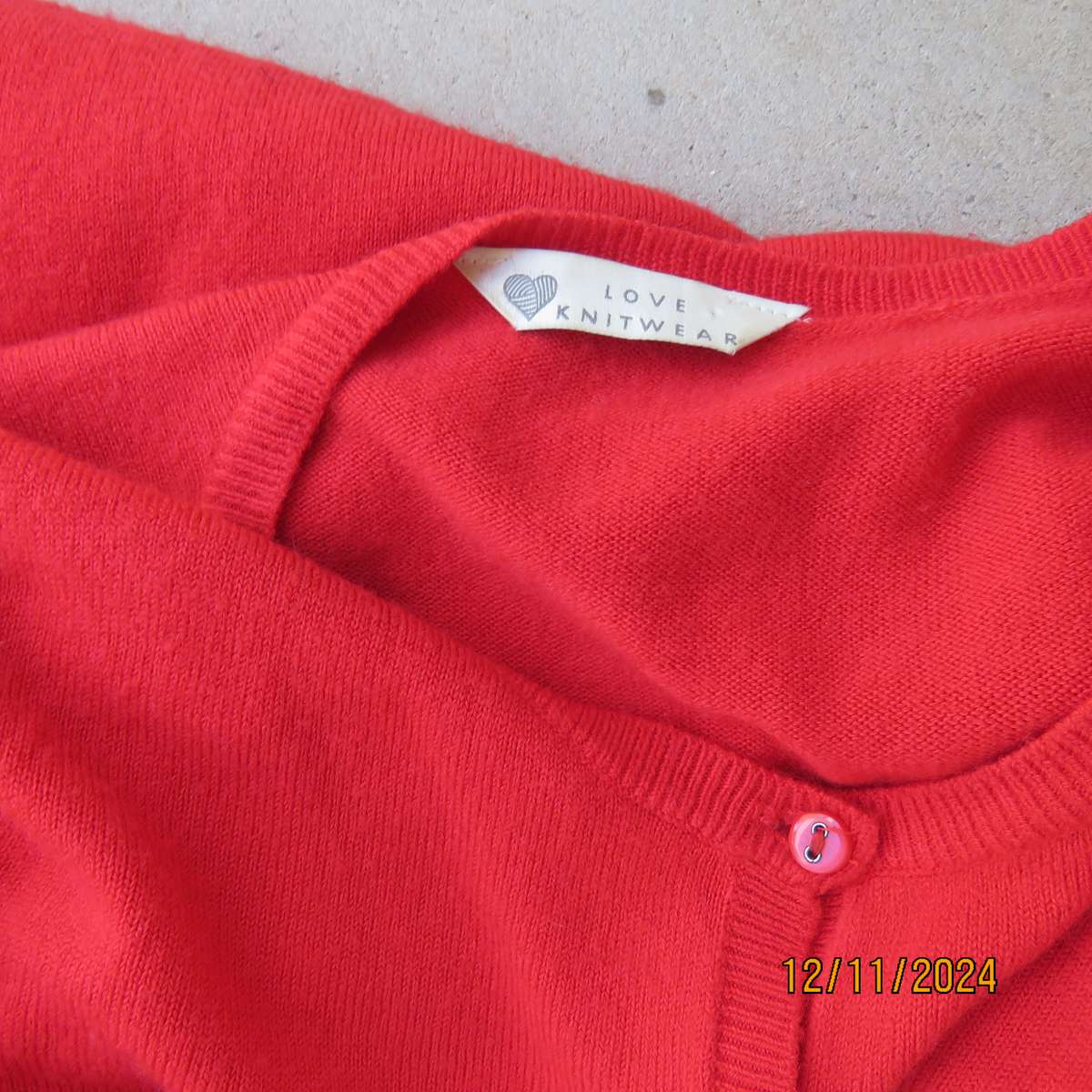 Bright red LOVE KNITWEAR long sleeve button down cardigan in 100% acrylic. Size 34. As new.