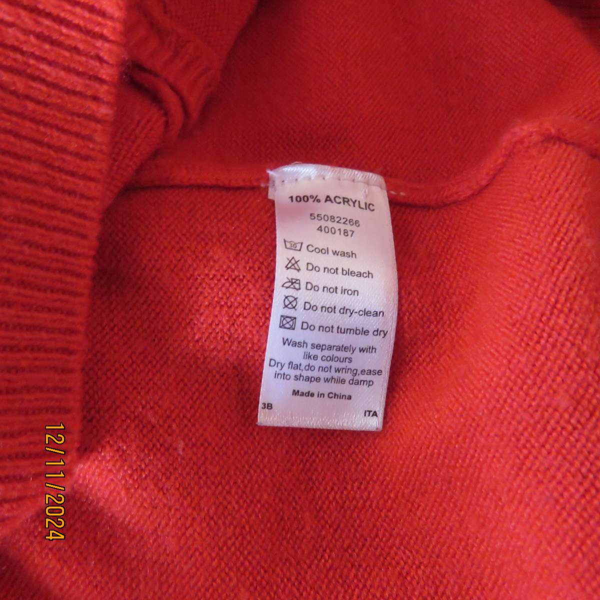 Bright red LOVE KNITWEAR long sleeve button down cardigan in 100% acrylic. Size 34. As new.