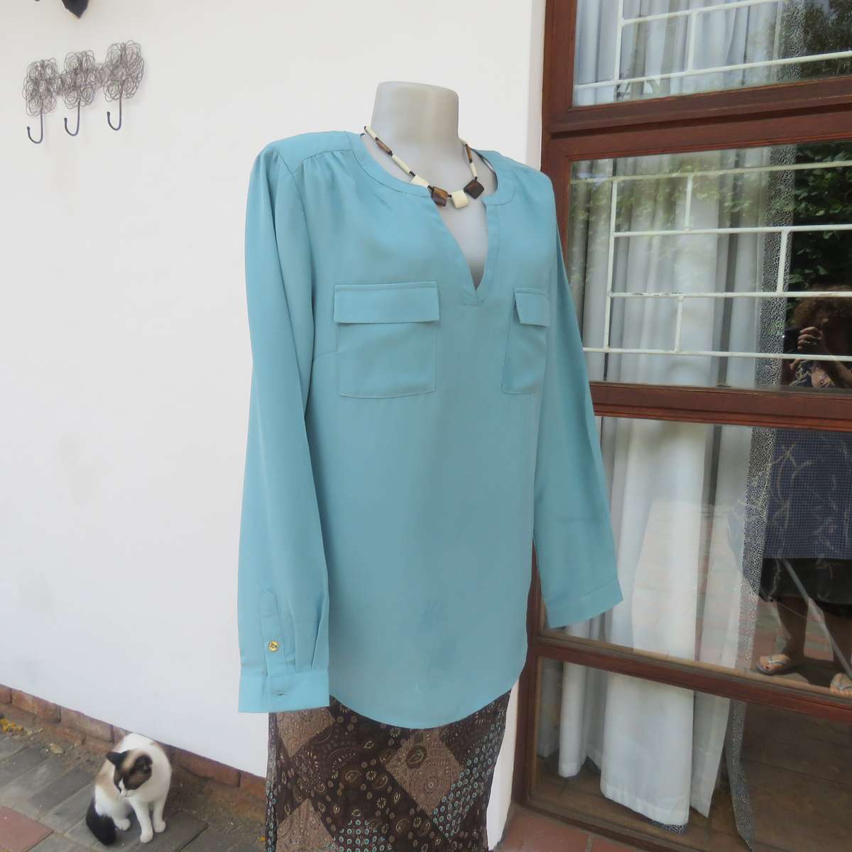 CHARTER CLUB jade long sleeve polyester slip over top with 2 small flap pockets. Size 36.As new cond