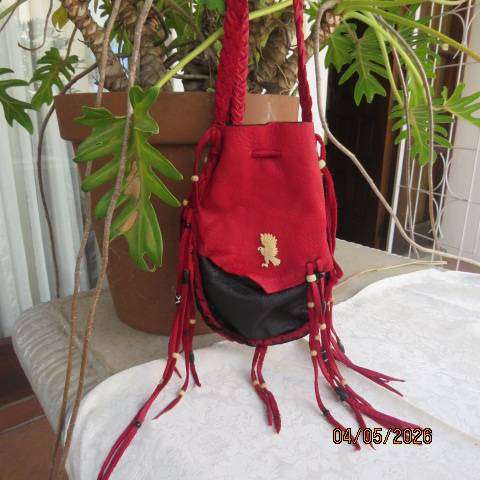 Genuine leather black handmade shoulder bag with red leather front overlay and fringed sides