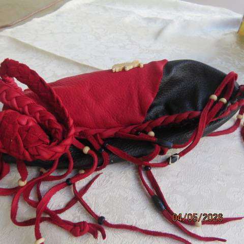 Genuine leather black handmade shoulder bag with red leather front overlay and fringed sides