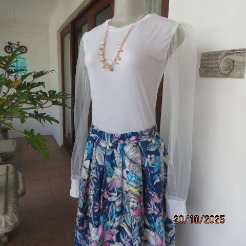 White stretch polyester bodyshirt with sheer sleeves. Press button closure. Size 34.