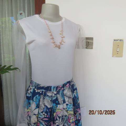 White stretch polyester bodyshirt with sheer sleeves. Press button closure. Size 34.