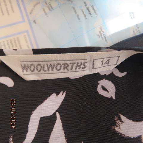 Woolworths black and white open-front jacket with elbow sleeves and low collar, size 38-40