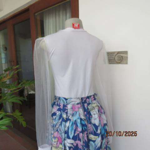White stretch polyester bodyshirt with sheer sleeves. Press button closure. Size 34.