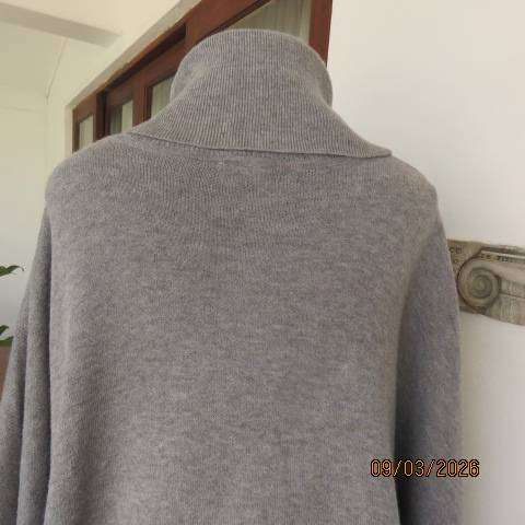 Donatella light grey acrylic knit poncho with high fold-over polo neck, size 38-42