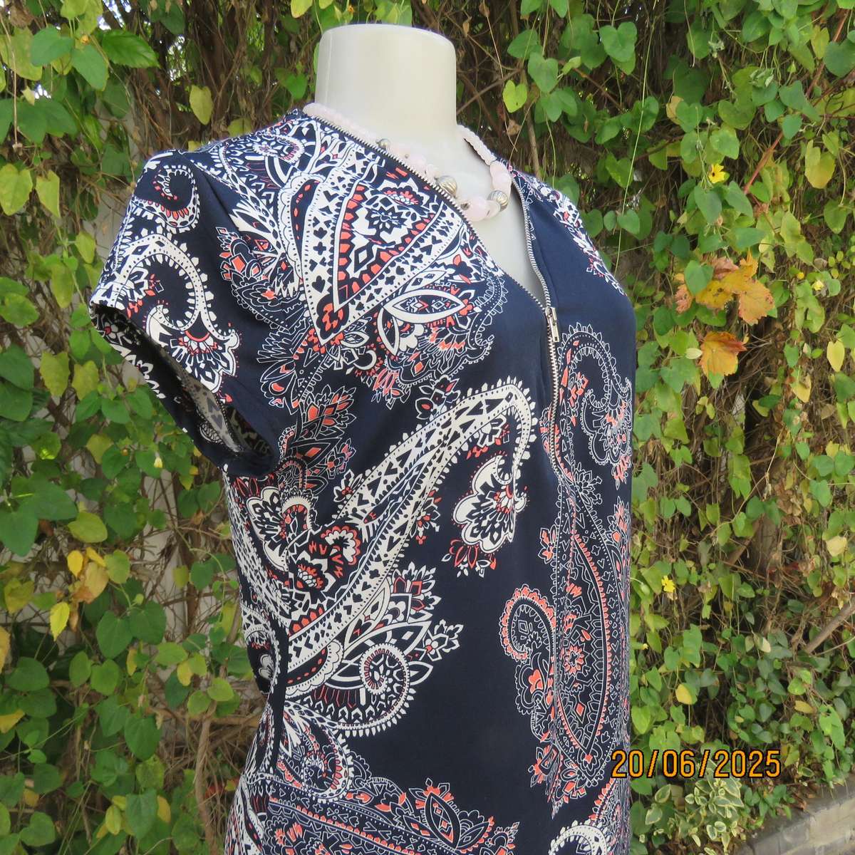 AMARA navy capped sleeve top with crimson-white baroque print. V zip up front. Size 36