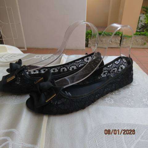 Pair of black floral pattern gauze flat shoes with open toes and bows on front. Size 8