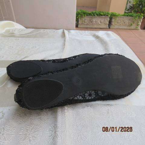 Pair of black floral pattern gauze flat shoes with open toes and bows on front. Size 8