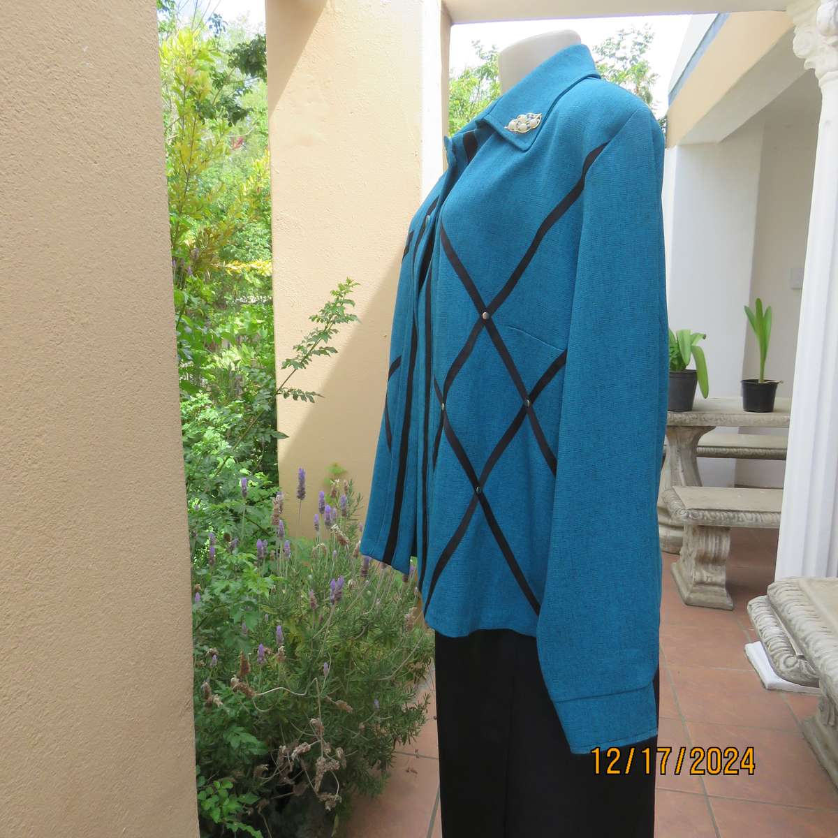 State of the art blue jade -black mottled polyester jacket.Criss-cross black decoration.Size 42.