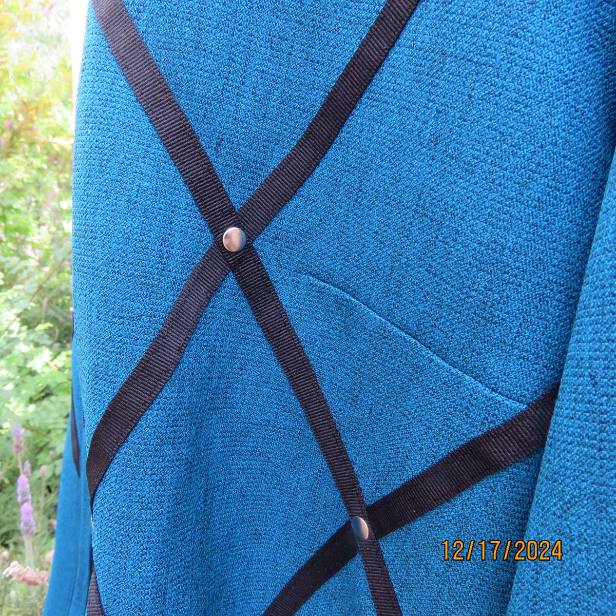 State of the art blue jade -black mottled polyester jacket.Criss-cross black decoration.Size 42.