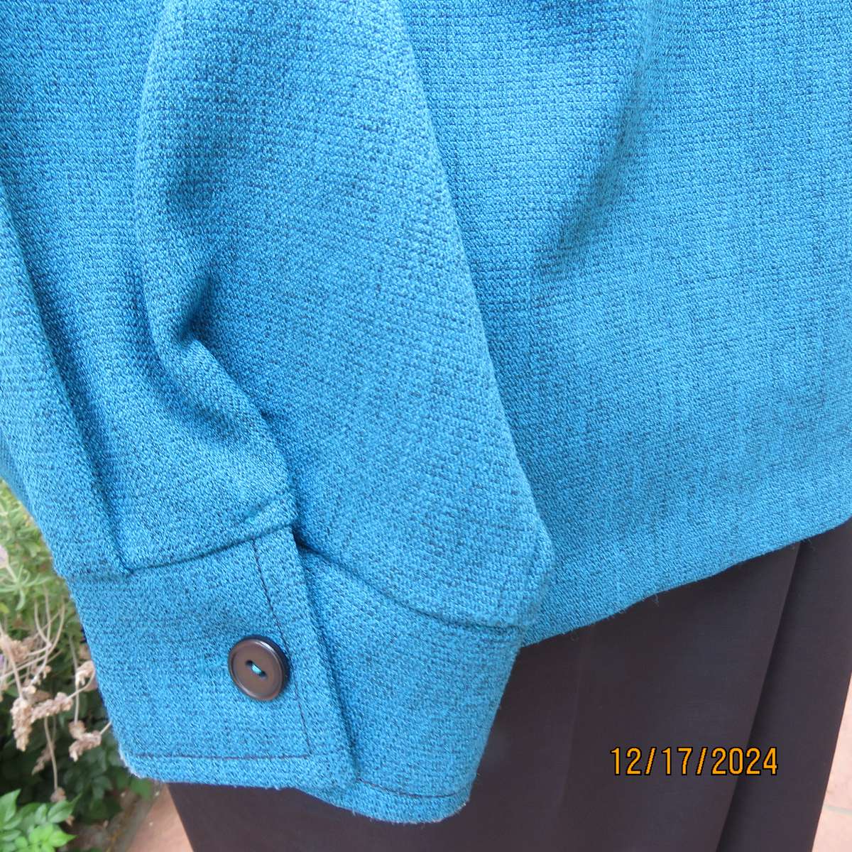 State of the art blue jade -black mottled polyester jacket.Criss-cross black decoration.Size 42.