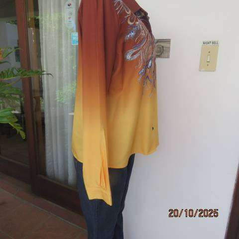 Golden brown-rust-yellow button down long sleeve top with blue feathery paisley print. Size 40