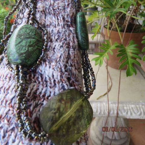 Attractive long green oval beaded necklace with three string tiny connection beads