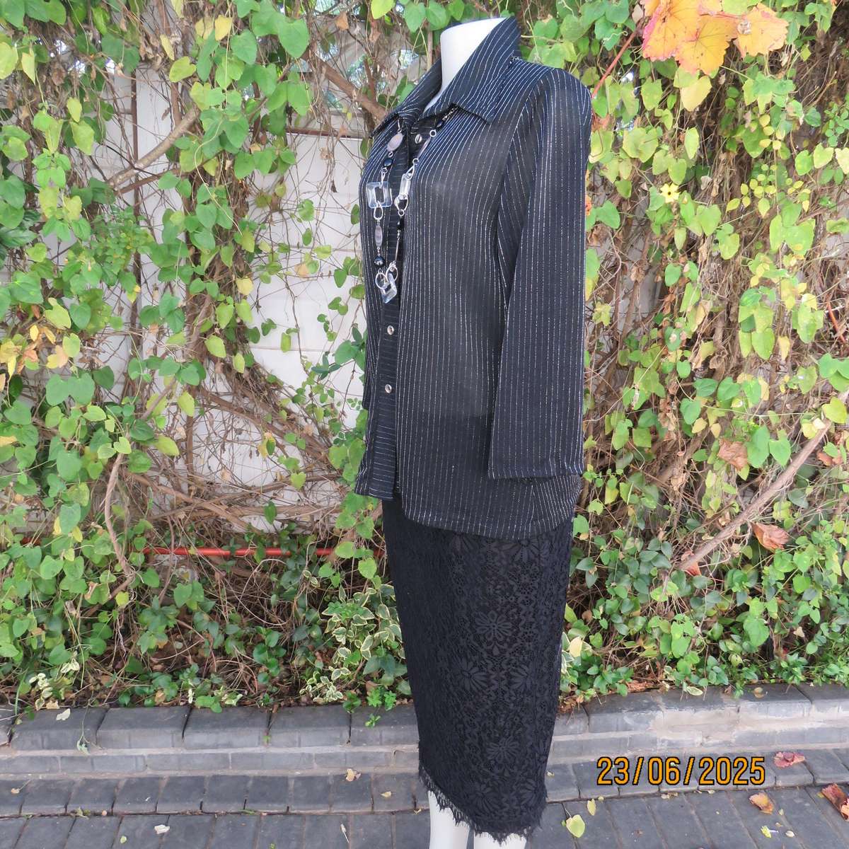 CARO smart casual black stretch polyester top with silver vertical stripes. Size 40