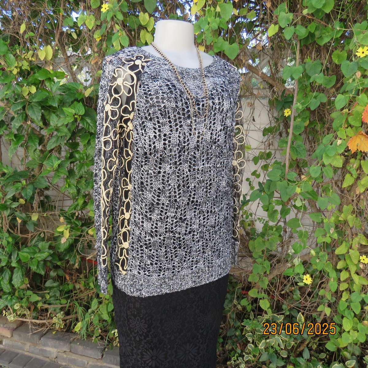 Black- silver -tiny sequins loose acrylic knit evening long sleeve top. Gold cord decor. Size 38