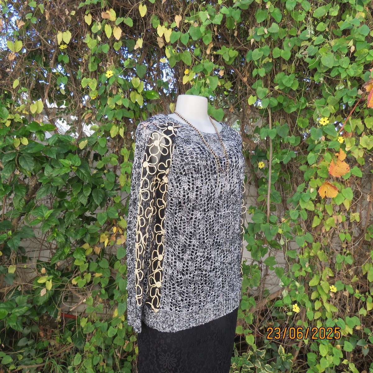Black- silver -tiny sequins loose acrylic knit evening long sleeve top. Gold cord decor. Size 38