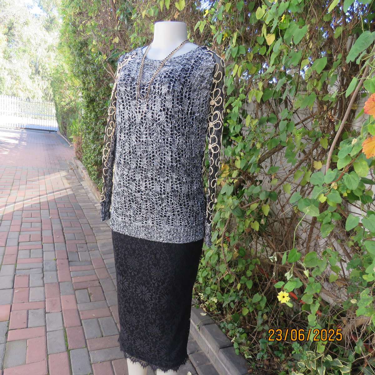 Black- silver -tiny sequins loose acrylic knit evening long sleeve top. Gold cord decor. Size 38