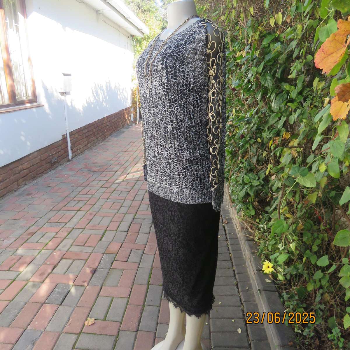 Black- silver -tiny sequins loose acrylic knit evening long sleeve top. Gold cord decor. Size 38