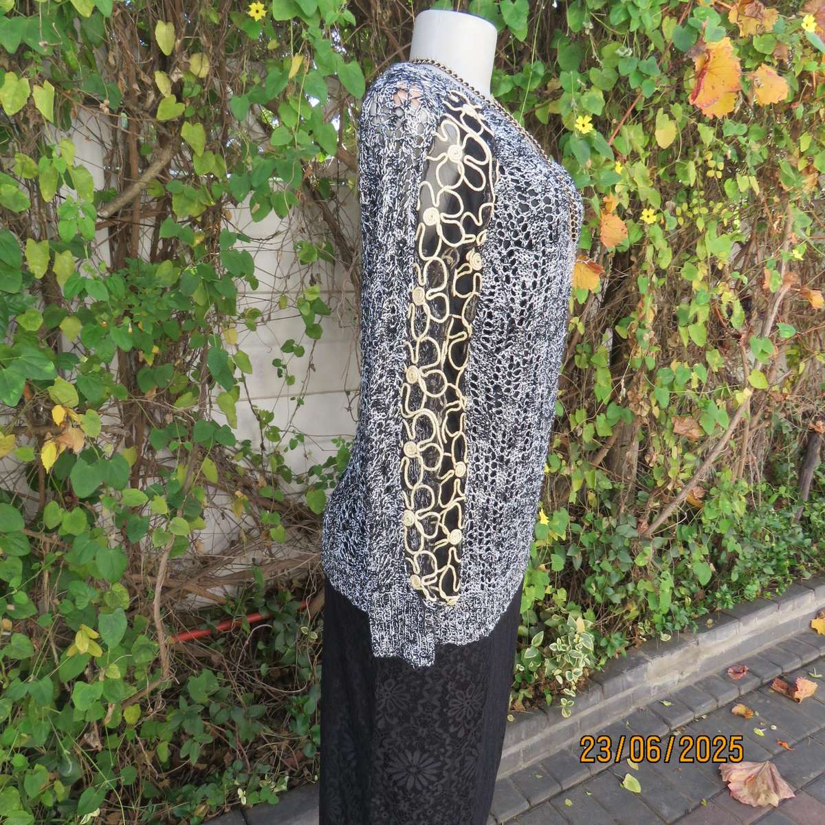 Black- silver -tiny sequins loose acrylic knit evening long sleeve top. Gold cord decor. Size 38