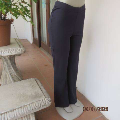 MILADYS dark navy stretch rayon-nylon pants with wide elastic waistband. Bootlegged. Size 38
