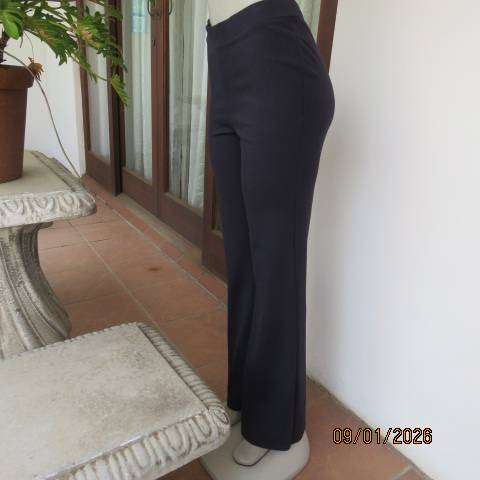 MILADYS dark navy stretch rayon-nylon pants with wide elastic waistband. Bootlegged. Size 38