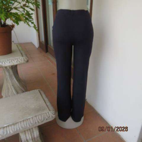 MILADYS dark navy stretch rayon-nylon pants with wide elastic waistband. Bootlegged. Size 38