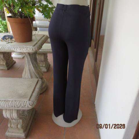 MILADYS dark navy stretch rayon-nylon pants with wide elastic waistband. Bootlegged. Size 38