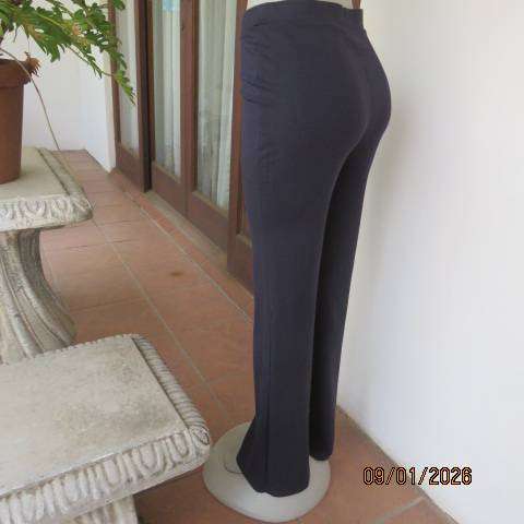 MILADYS dark navy stretch rayon-nylon pants with wide elastic waistband. Bootlegged. Size 38