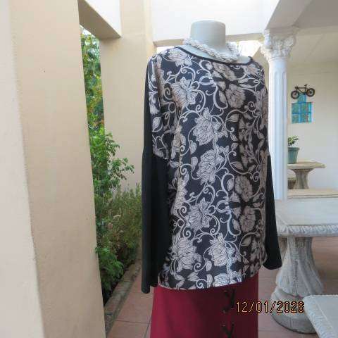 FABULOUS black stretch polyester long sleeve top with slate black-cream floral silky front. Size 44