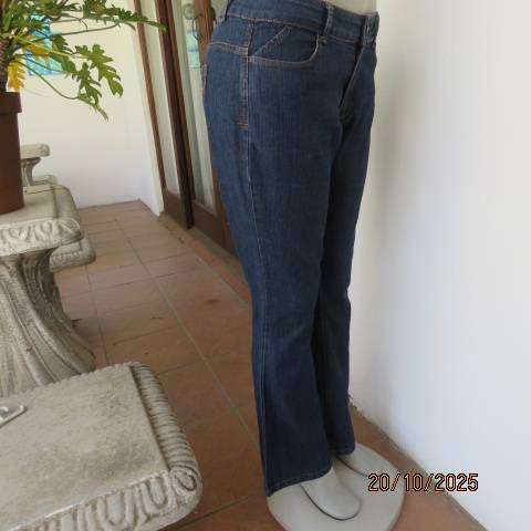Blue denim jeans in stretch polycotton with flare legs. Size 36
