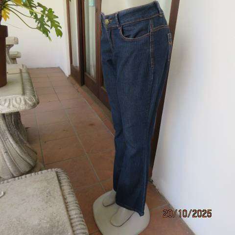 Blue denim jeans in stretch polycotton with flare legs. Size 36