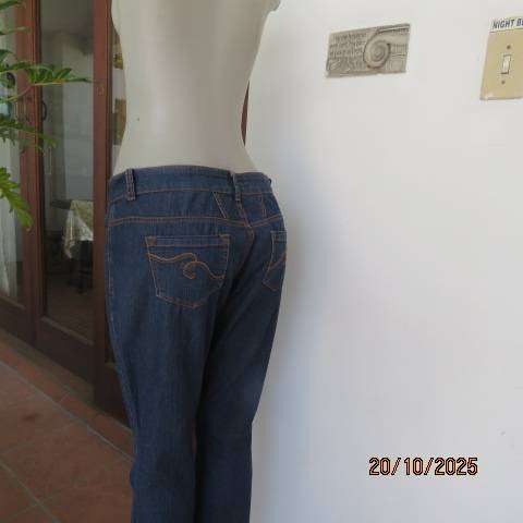 Blue denim jeans in stretch polycotton with flare legs. Size 36