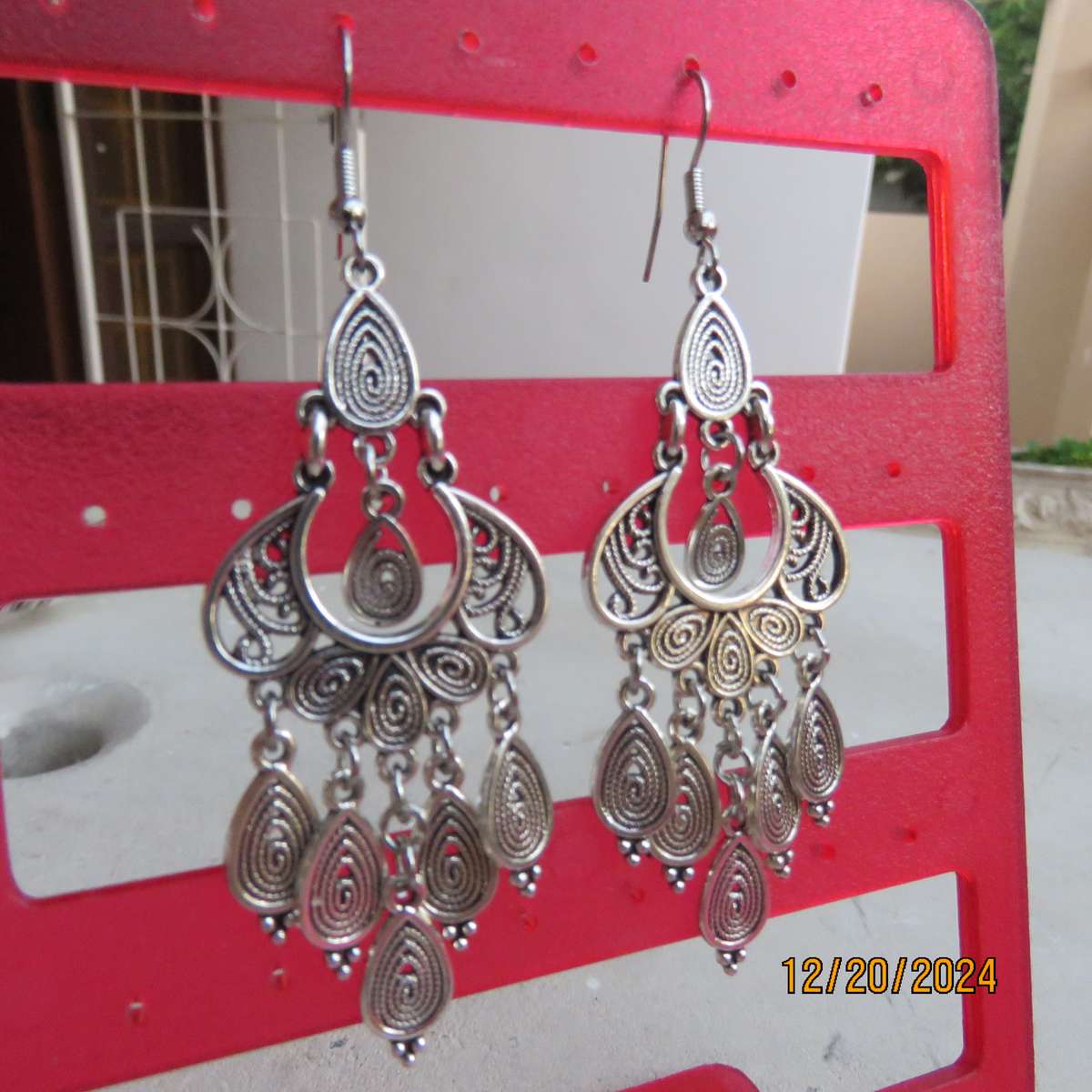 Pair of beautiful drop and dangle earrings in silver shade. 6cm long. New item.