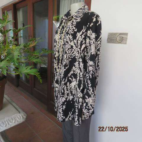 PENNY C black high quality polyester top with white floral print. Size 46-22