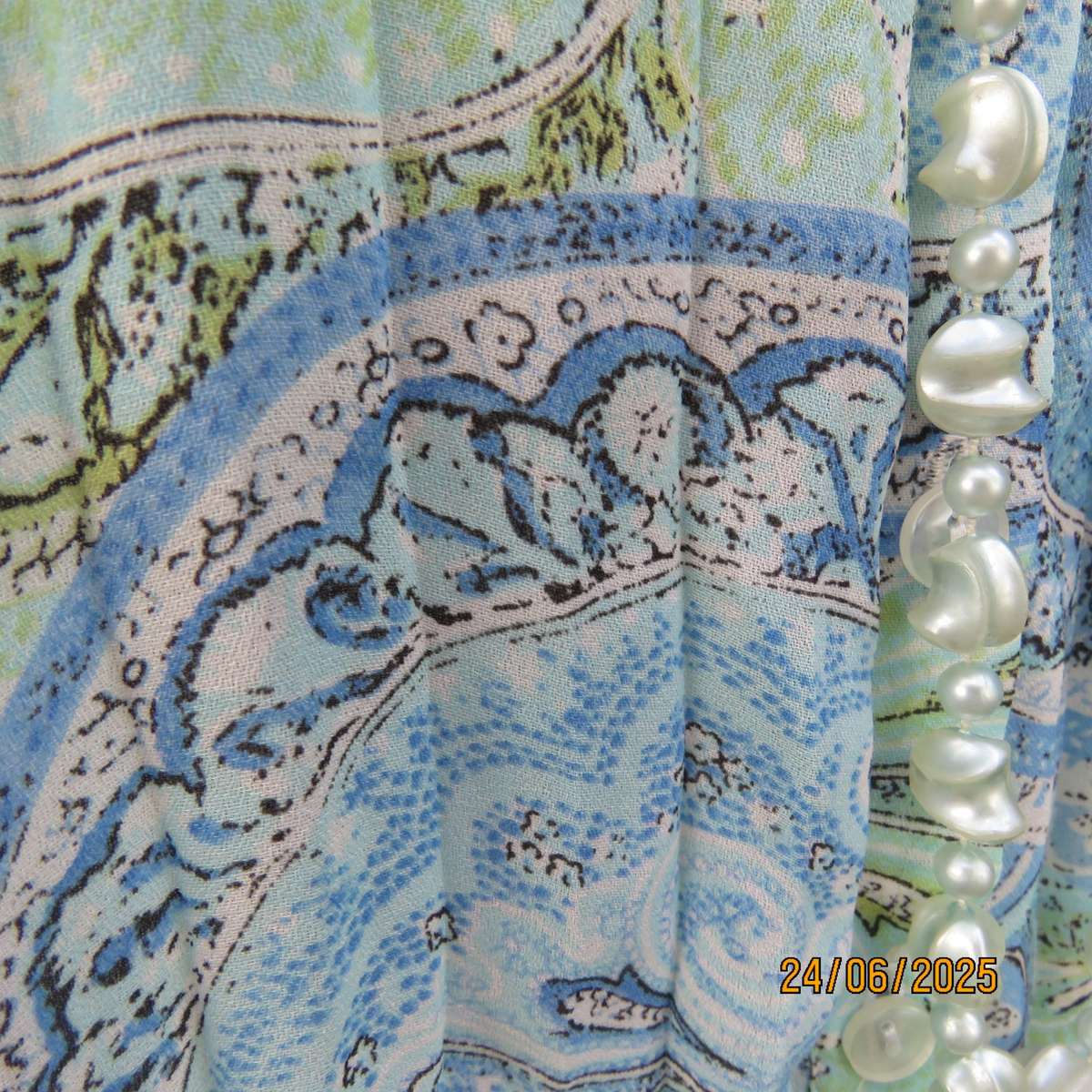 Soft blue-green permanent pleated paisley printed polyester top. Size 38.