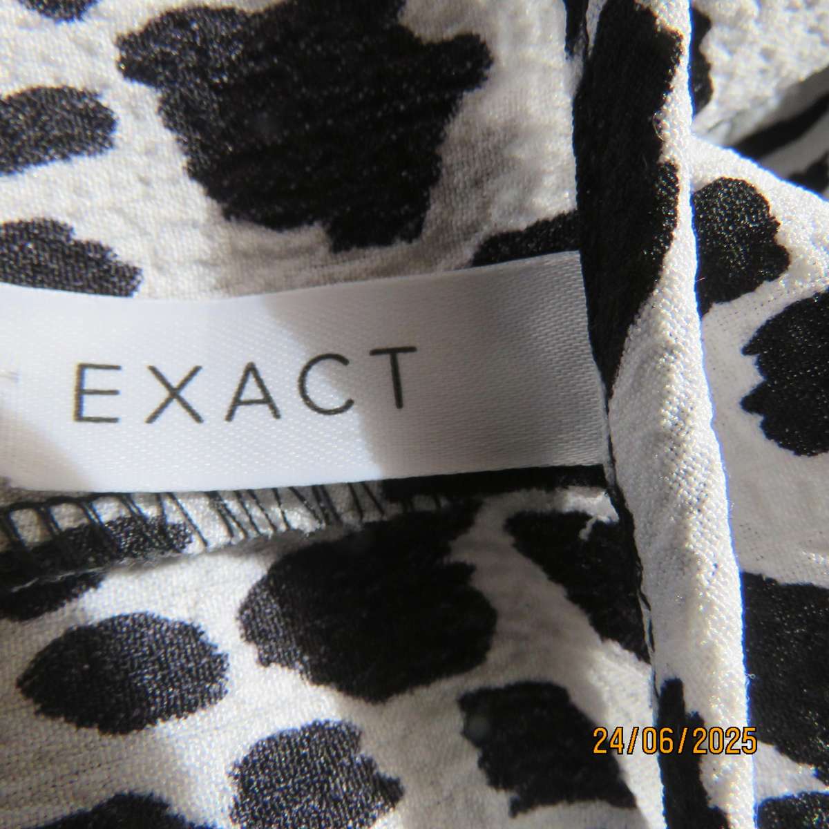 EXACT animal print black-white knee length tiered dress with long sleeves. Size 34