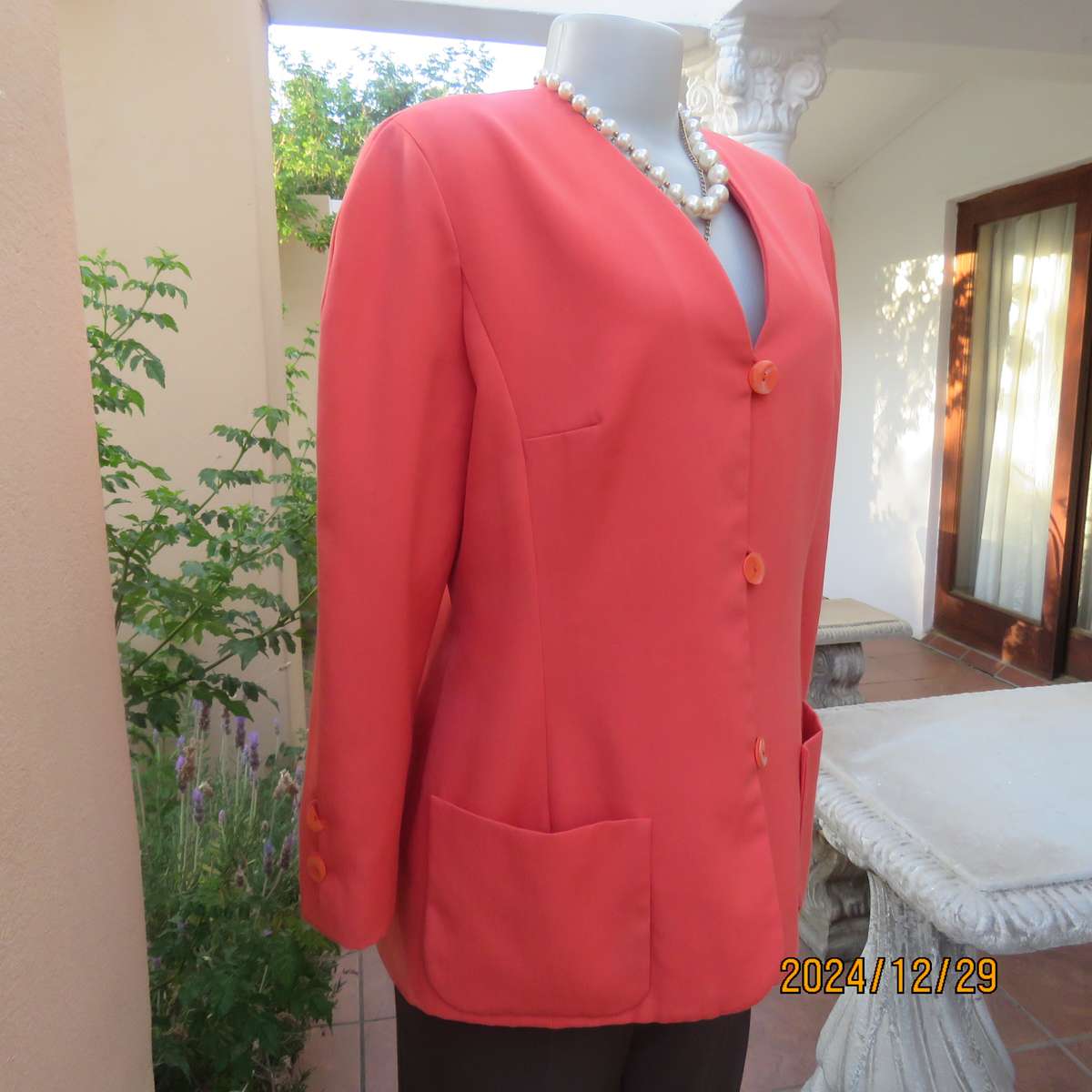Stunning boutique made papaya colour long sleeve lined collarless jacket.Size 38.Poly-viscose blend.