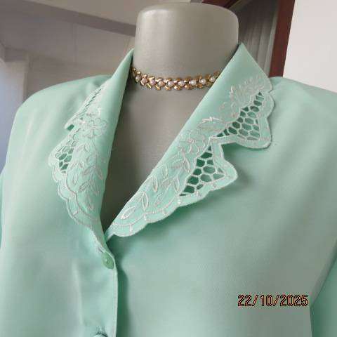 SHIGE mint green short sleeve silky polyester top with richly embroidered collar. Size 42